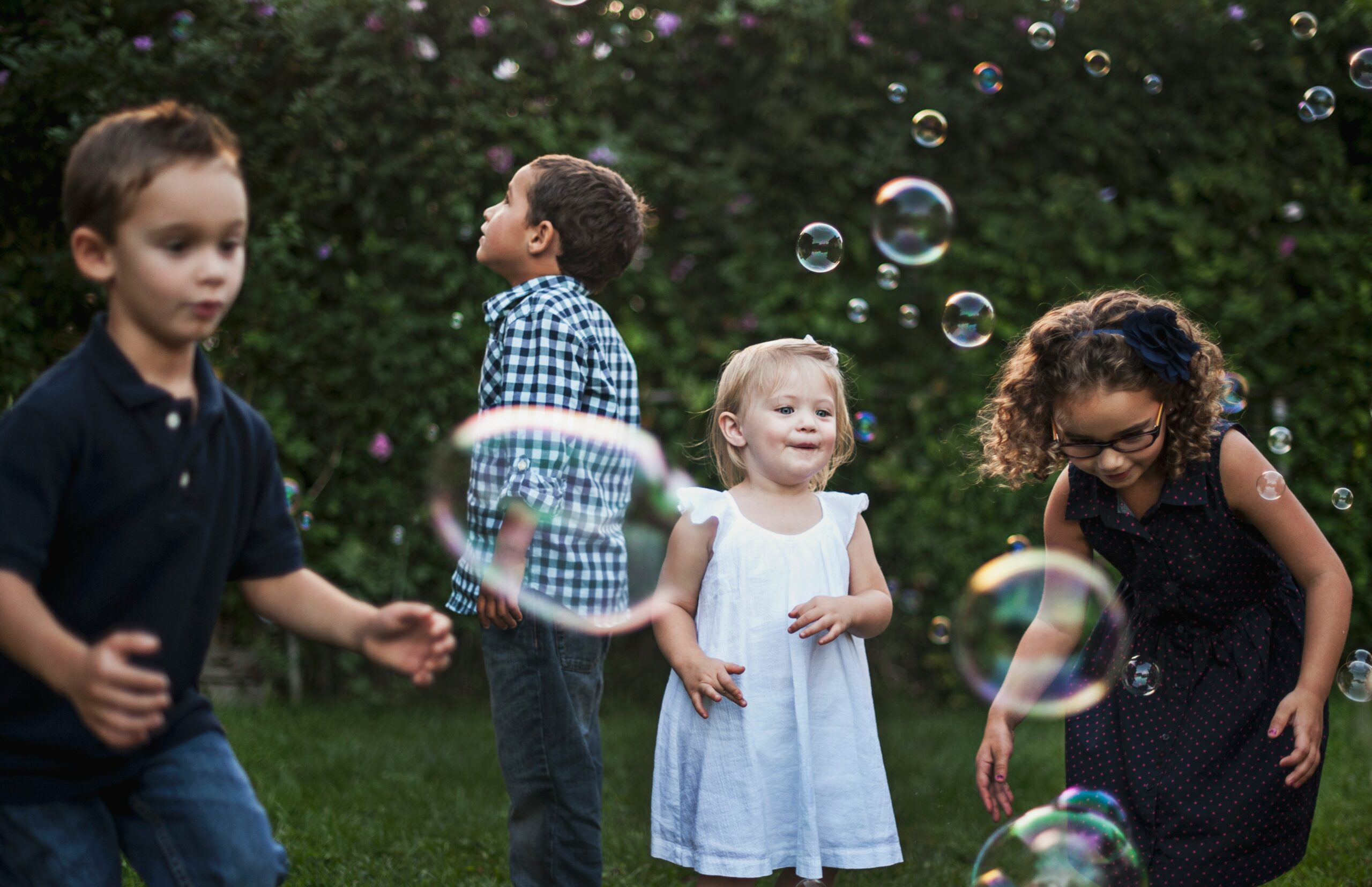 children playing with bubbles